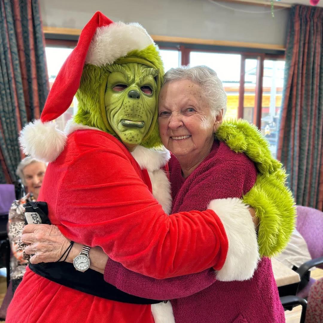 The Grinch’s visit to May Shaw Health Centre in Swansea, Tasmania, brings joy to residents like Gwen Castle.